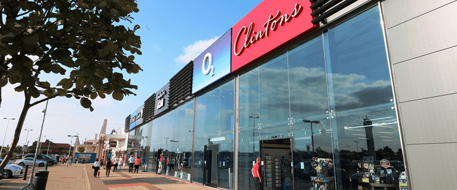 Modern shopping center with large glass windows, featuring O2 and Cleethorpes signage, and shoppers outside.