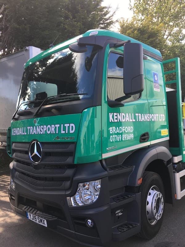 Green Mercedes truck with "KENDALL TRANSPORT LTD" and "BRADFORD" signage, parked in a yard.