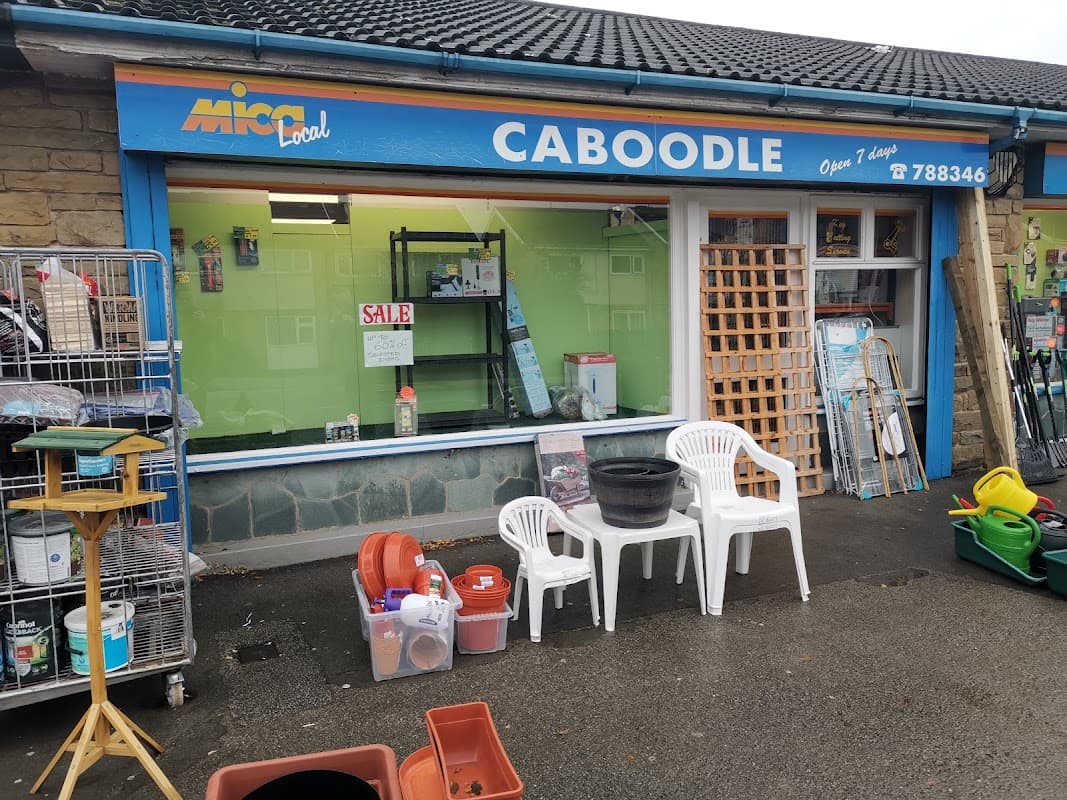 Bright storefront of Caboodle, featuring garden supplies, chairs, and a sale sign in York, Yorkshire.