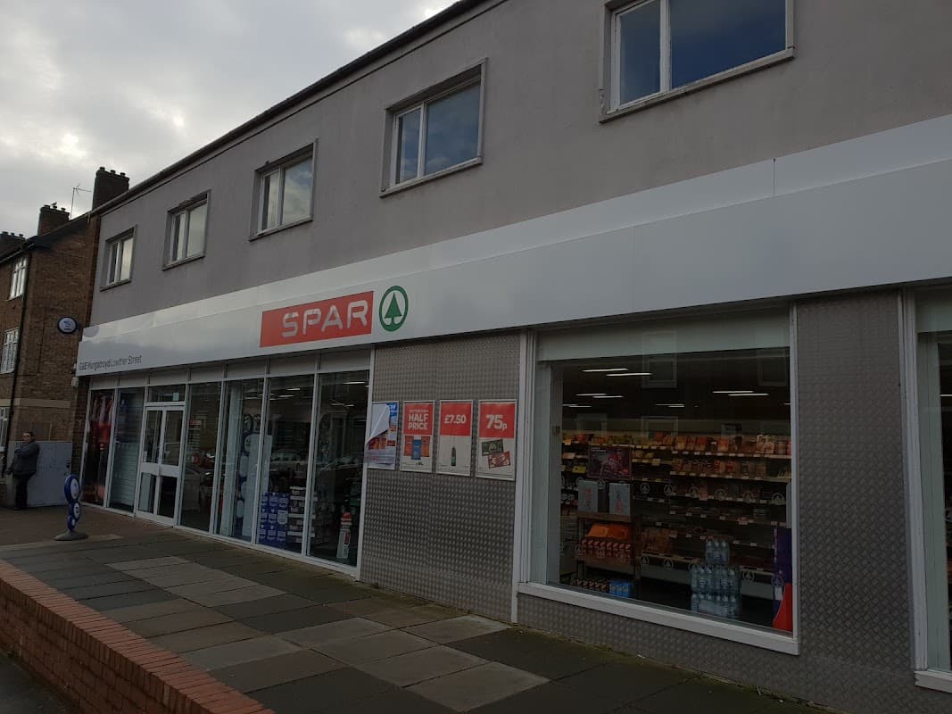 SPAR store exterior on Lowther Street, showcasing large glass windows and a modern facade.