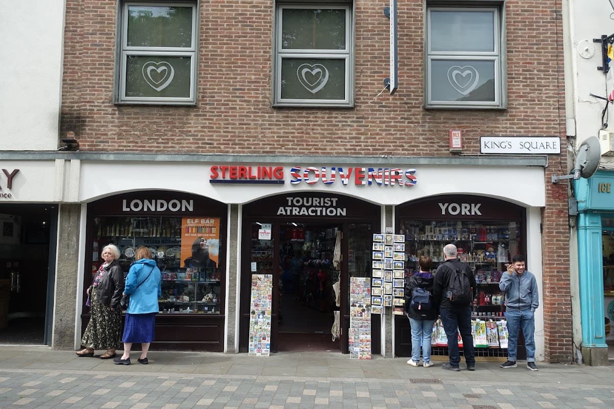 Sterling Souvenirs shopfront in York, featuring colorful displays and visitors browsing outside.
