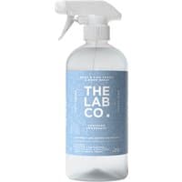 Clear spray bottle with blue label, "The Lab Co. Fabric & Room Spray - Soothing," white trigger nozzle, 500ml.