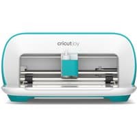 Compact Cricut Joy cutting machine, white with teal accents, featuring a blade and pen holder inside.