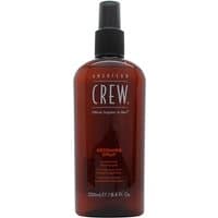 Brown American Crew Grooming Spray bottle, 250ml, with black spray nozzle and white text label.