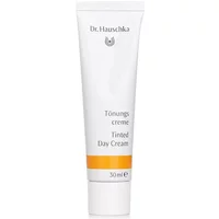 White tube of Dr Hauschka Tinted Day Cream 30ml with orange stripe and black text.