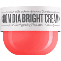 Bright pink jar of Sol de Janeiro Bom Dia Bright Cream with white lid and bold black text.