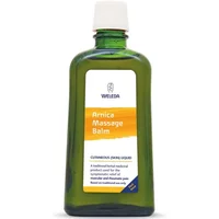Green glass bottle of Weleda Arnica Massage Balm 200ml with white cap and orange label.