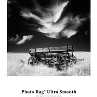 Black and white photo of a vintage wooden cart in a field, labeled "Photo Rag Ultra Smooth" by Back to the Office.