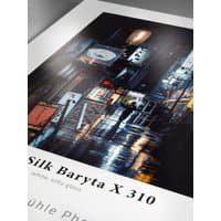 Hahnemühle Photo Silk Baryta X 310 paper with glossy finish, featuring a vibrant cityscape print.
