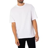 White Bradley T-Shirt by jack & jones, short sleeves, crew neck, relaxed fit, worn by a model with black pants.