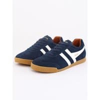 Navy suede trainers with off-white stripes, moody orange accents, and gum sole.