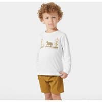 White Helly Hansen kids' long sleeve top with gold graphic of trees and moose, worn by child with curly hair.