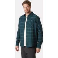 Green Helly Hansen flannel shirt, long sleeves, plaid pattern, button-up, chest pocket, worn by male model.