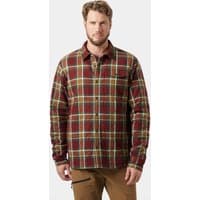 Brown Helly Hansen shacket with plaid pattern, button-up front, and chest pocket, worn by a male model.
