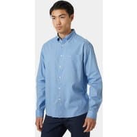 Blue Helly Hansen men's casual shirt, button-down, long sleeves, small logo on chest, worn by model.