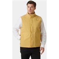 Beige Helly Hansen men's insulated vest with high collar, front pockets, and button closure, worn over white shirt.