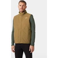 Brown Helly Hansen insulated vest with front buttons, high collar, and logo on chest, worn by a model.