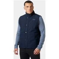 Navy Helly Hansen insulated vest with high collar, button closure, and logo on chest, worn by a model.