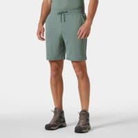 Green Helly Hansen men's shorts with drawstring waist, side pockets, and knee-length fit.