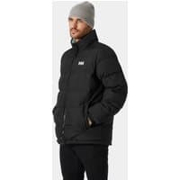 Black Helly Hansen reversible puffer jacket, 2XL, with high collar and logo on chest, worn by a model with a gray beanie.