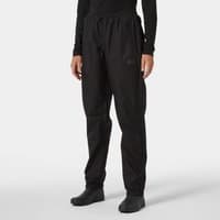 Black Helly Hansen women’s waterproof trousers with elastic waistband, adjustable cuffs, and subtle logo on left thigh.