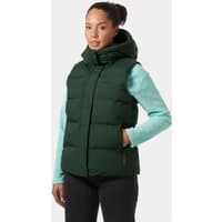 Green Helly Hansen women's puffy vest, XS, with high collar and zip pockets, worn over a light blue long-sleeve shirt.