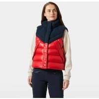 Red Helly Hansen women's down vest, size S, with black shoulder panels and high collar, worn over a beige top.