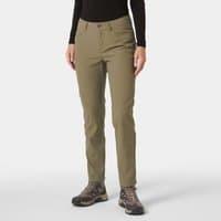Green Helly Hansen women's trousers, five pockets, slim fit, button closure, worn with black top and hiking shoes.