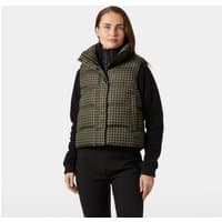 Brown Helly Hansen women's vest, XS, with a quilted pattern and high collar, worn over a black long-sleeve top.