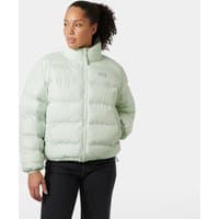Reversible green puffer jacket, XS, with high collar and Helly Hansen logo on chest, worn by a model.