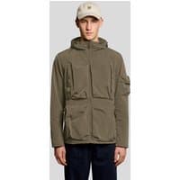 Green Lyle & Scott men's windbreaker jacket with hood, front pockets, and zip closure, worn by a model with a cap.
