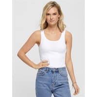 White tank top with scoop neckline and fitted design, worn by a model with blonde hair, paired with blue jeans.