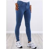 Blue skinny fit jeans with medium blue denim, five pockets, and button closure, worn with white sneakers.