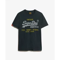 Black Superdry T-shirt with yellow and white vintage logo text, short sleeves, and relaxed fit.
