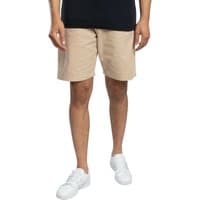 Beige Tony Carpenter shorts by jack & jones, knee-length with side pockets, worn by a model with white sneakers.