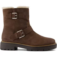 Brown TOMS Ionie Moto women's boots with dual buckle straps and shearling lining on a chunky sole.