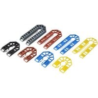Assorted colored plastic shims in U-shape, including red, blue, yellow, and black, for leveling and spacing.