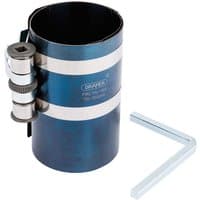 Blue Draper piston ring compressor with adjustable clamp and L-shaped wrench, 75mm-140mm capacity.