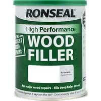 Green and white Ronseal High Performance Wood Filler tin, 1kg, labeled for major wood repairs, with natural filler.
