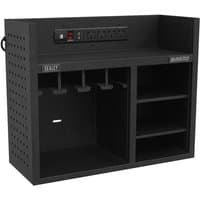Black Sealey power tool storage rack with power strip, pegboard sides, hooks, and shelving compartments.