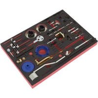 Red and black Sealey timing tool kit with 36 pieces for Ford, including pulleys, pins, and wrenches in foam tray.