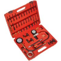 Red Sealey VSE3156 kit with gauges, hoses, and adapters in a molded case for compression, leakage, and TDC testing.