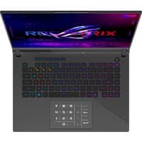 ASUS Strix G16 laptop with RGB keyboard, 16" screen, sleek black design, and illuminated ROG logo on the lid.