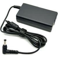 Black BTI 65W charger with rectangular adapter, 5.5mm x 2.5mm tip, and coiled UK power cable.