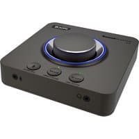 Black Creative Labs Sound Blaster X4 USB audio device with large central dial, LED ring, and multiple control buttons.