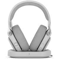 White Fractal Design Scape Light wireless gaming headset with cushioned ear cups on a sleek charging stand.