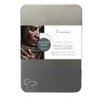Hahnemühle photo paper Gloss in a sleek silver tin with a label featuring a woman's portrait and product details.