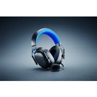 Black Razer BlackShark V3 X HyperSpeed headset with blue headband, wired and wireless options, detachable microphone.