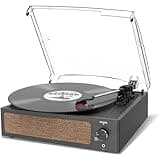 Trynnay black vinyl record player with built-in speaker, clear dust cover, and control knobs on front panel.