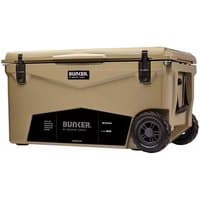 BUNKER 66L Cool Box in tan with black latches, wheels, and logo on the side.